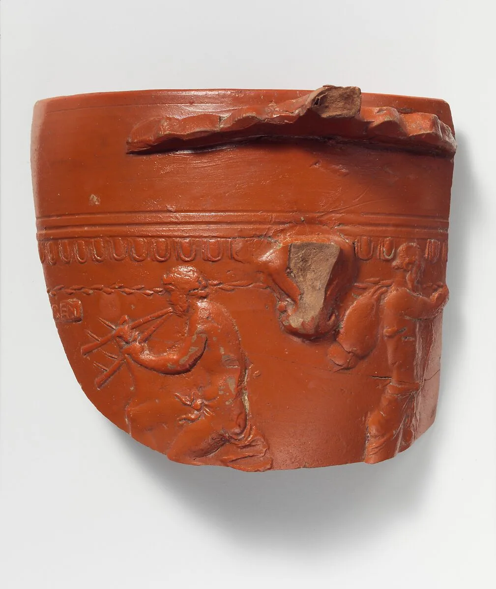 Terracotta fragment of an Arretine cup with satyrs — Perennius