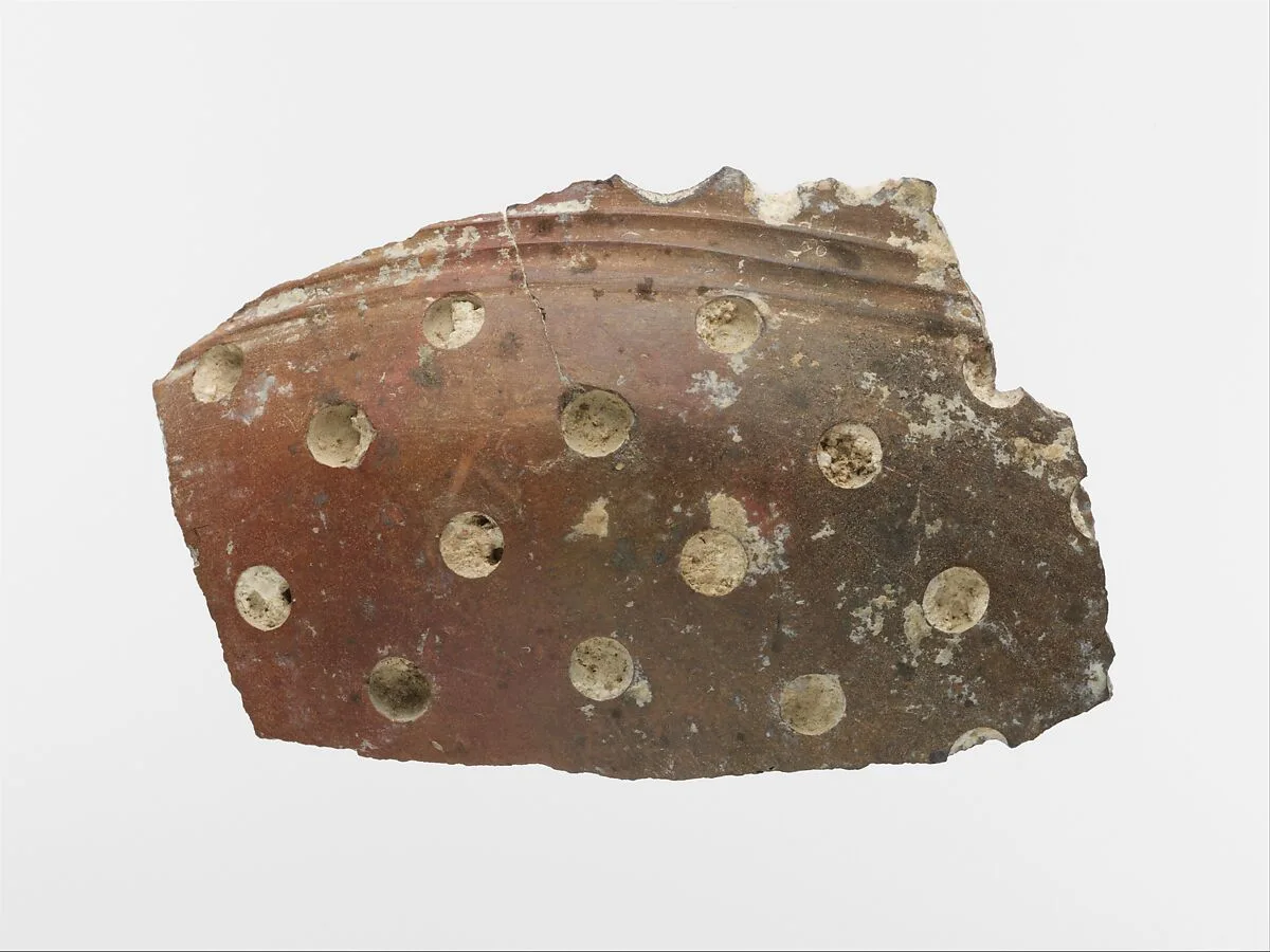 Terracotta vase fragment with white inlay — Unknown