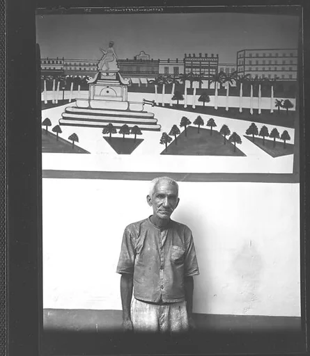 [Man in Front of Mural of Parque Central, Havana]