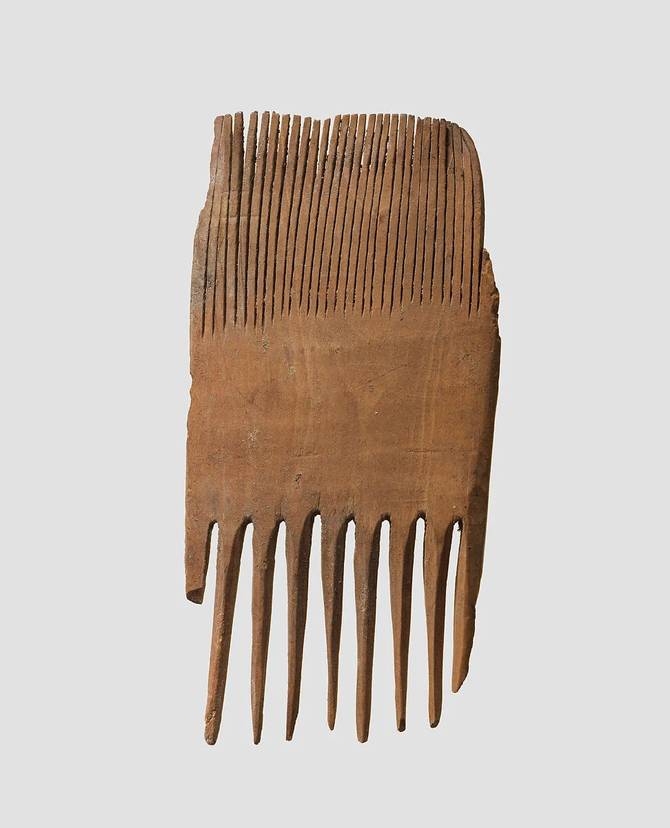 Double-sided wooden comb — Unknown