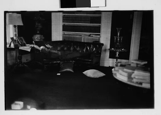 [Five 35mm Film Frames: Gifford Cochran Lying on Couch in Library, Croton Falls, New York]