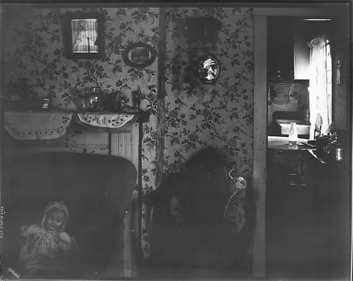 [Interior with Fireplace Mantle, Flower Print Wallpaper, and Armchair]