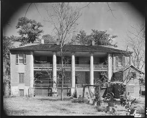 [House with Abandoned Trellis and Plantings in Yard, Natchez, Mississippi?]