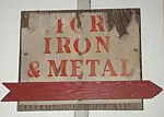 [Stenciled Sign: "For Iron & Metal"]