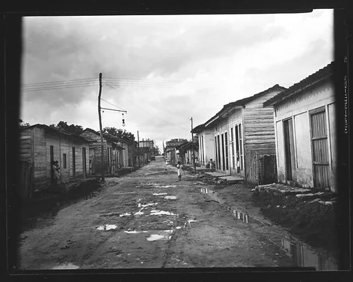 [View Down Dirt Road with Wooden Houses, Havana Outskirts, Cuba]