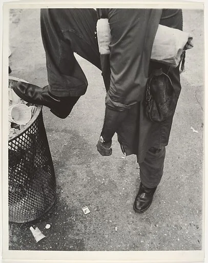 [Street Scene: Man Resting Foot on Lip of Trashcan, New York City]