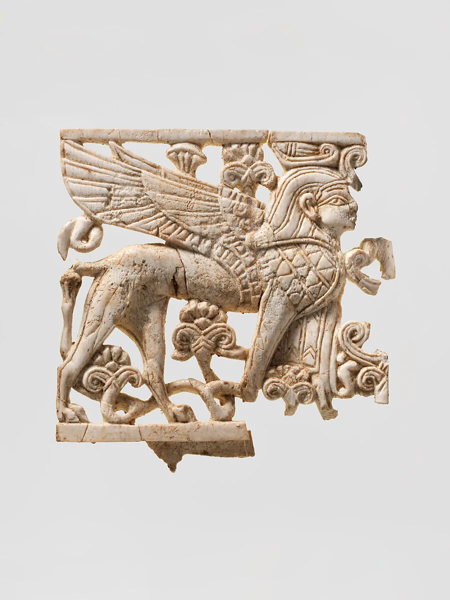 Openwork plaque with a sphinx striding through a floral landscape — Unknown