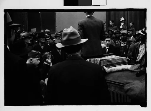 [Crowd Listening to Speaker Standing on Car Fender, Milledgeville, Georgia]