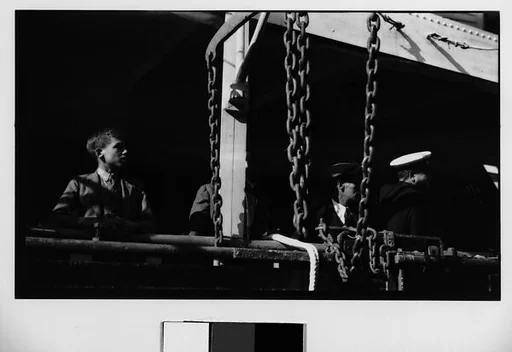 [Officers and Passengers on Deck of Docked Ship]