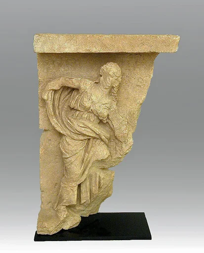 Limestone relief with the figure of a woman