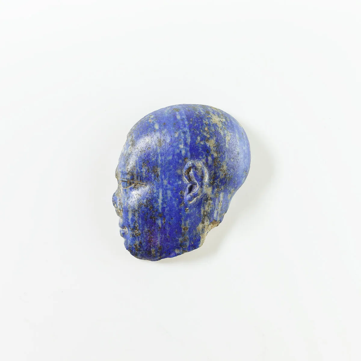 Portion of a Face, possibly a Child God — Unknown