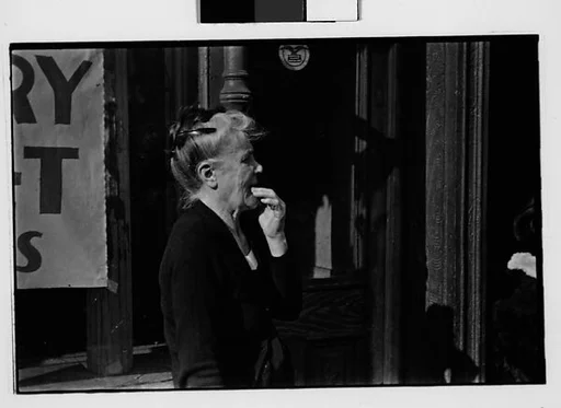 [Two 35mm Film Frames: Old Woman on Sidewalk, New York City]