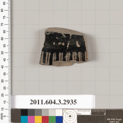 Terracotta fragment of a lid?