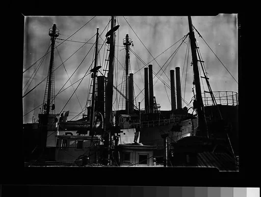 [Port Scene of Ships' Masts, Rigging, and Factory Smokestacks, New York City]