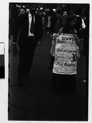 [Two 35mm Film Frames: Woman Wearing Sandwich Board Advertisement, Fourteenth Street, New York City]