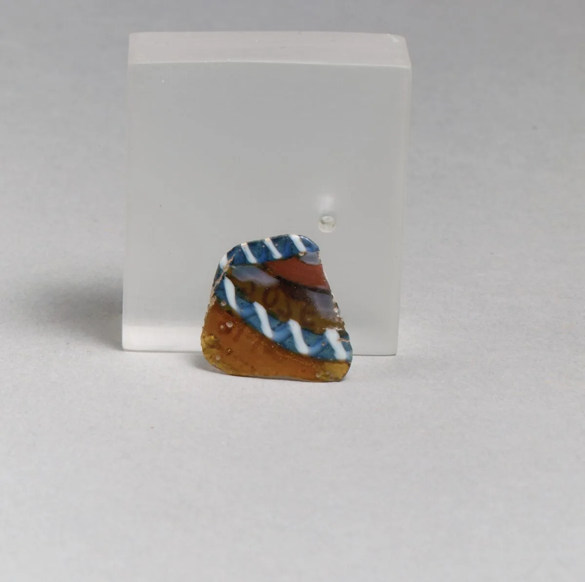 Glass striped mosaic bowl fragment — Unknown