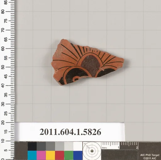 Terracotta fragment of a kylix: eye-cup (drinking cup)