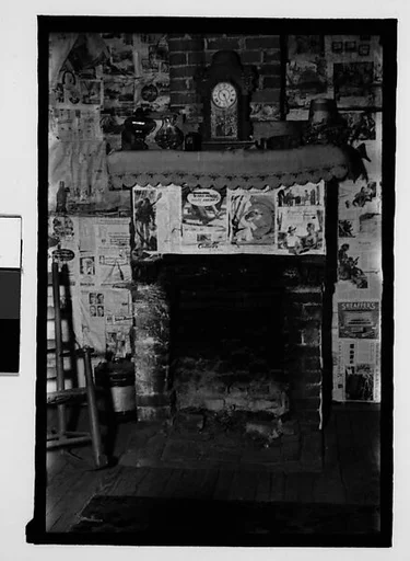[Interior with Newspaper-Covered Walls and Fireplace, Hale County?, Alabama]