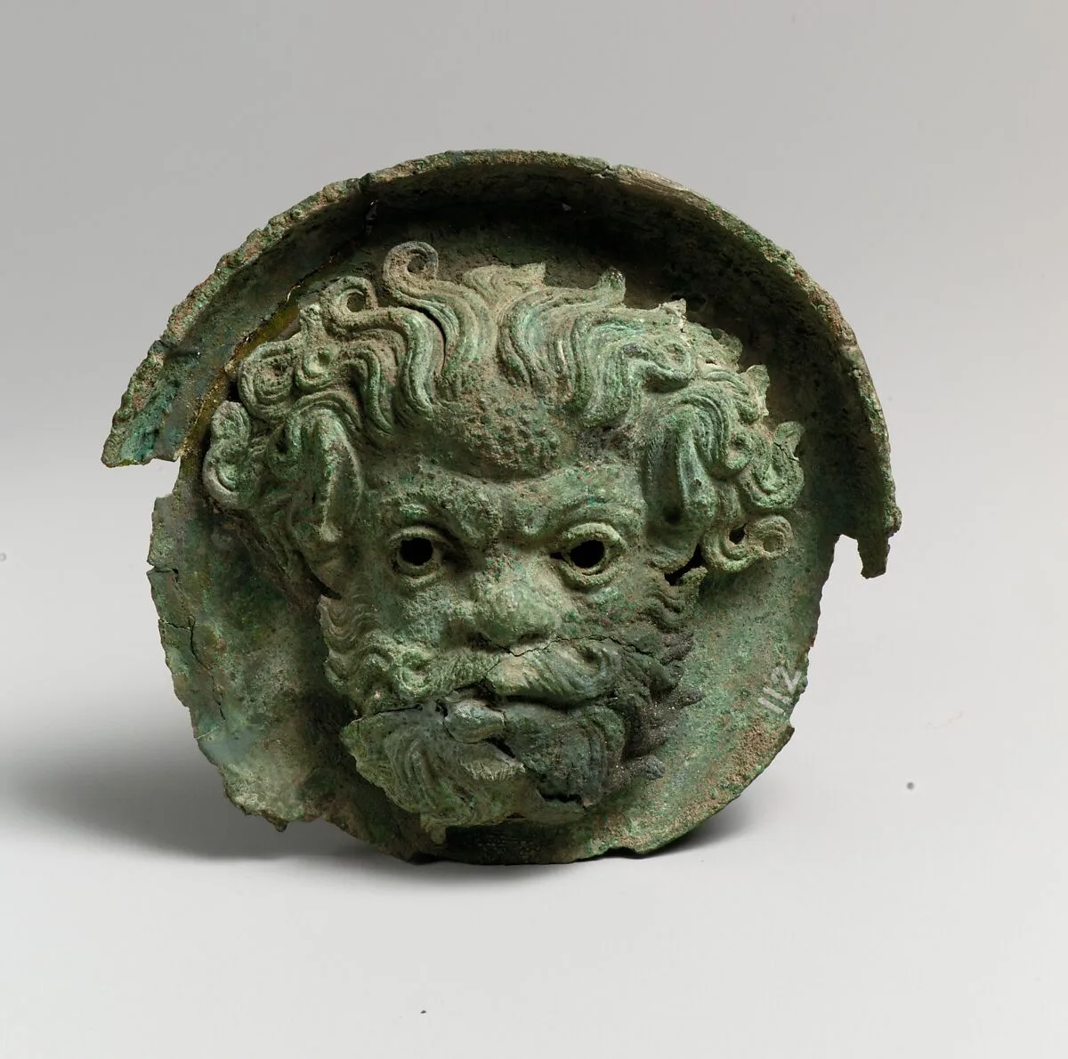 Silvered bronze roundel with satyr head (one of a pair) — Unknown