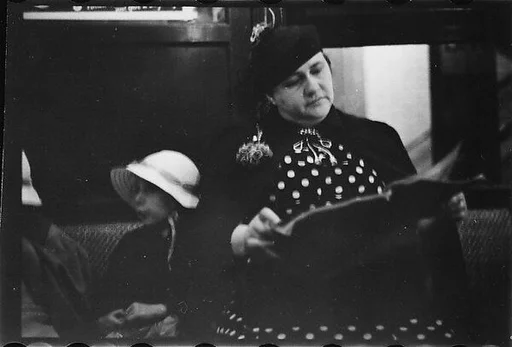 [Five 35mm Film Frames: Subway Passengers, New York City: Woman in Polkadot Dress Reading and Little Girls]
