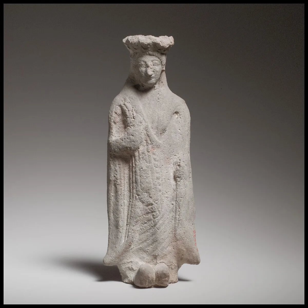 Terracotta statuette of a standing woman — Unknown