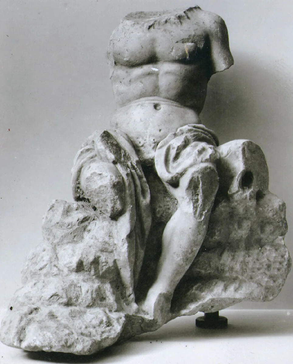 Marble statuette of a seated man — Unknown