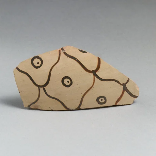 Terracotta vessel fragment with net pattern and dots within circles