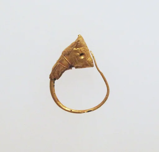 Gold earring with head of a bull