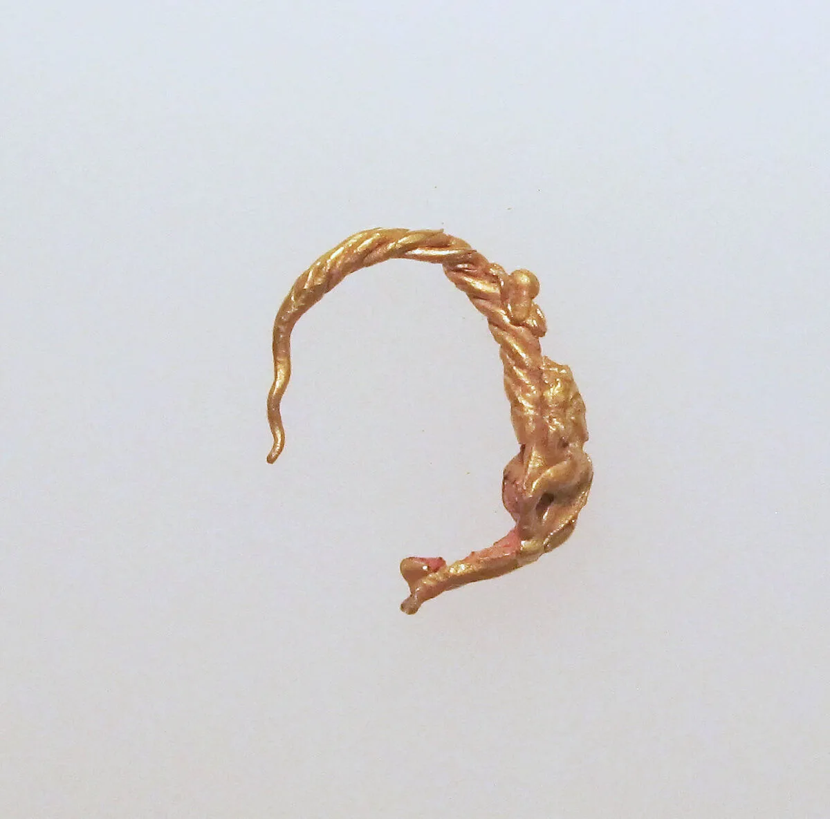 Gold earring with figure — Unknown