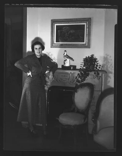 [Unidentified Woman Leaning on Fireplace Mantle]