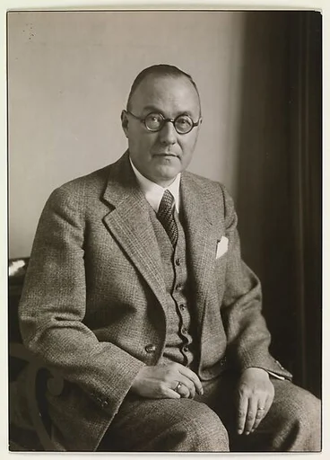 [Man Wearing Glasses in Three Piece Suit, Seated, Germany]