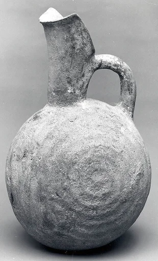 Spouted jug with raised concentric circles
