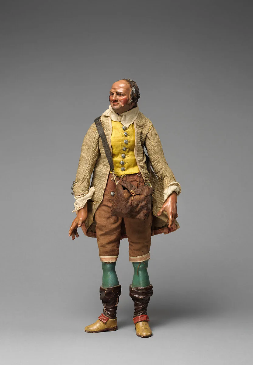 Gentleman with yellow vest, tan/maroon knickers, beige coat, falling down stockings over blue legs, and shoulder bag — Unknown