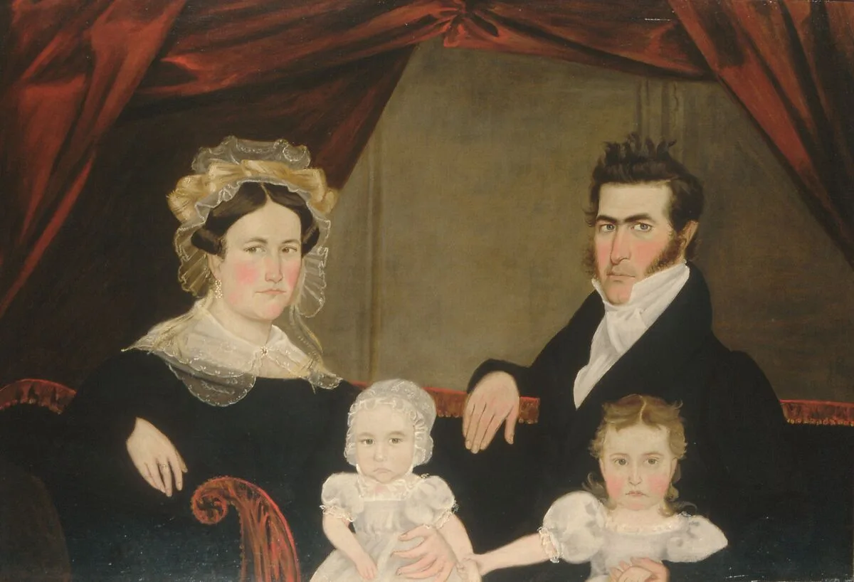Family Group of Four on Sofa — Unknown