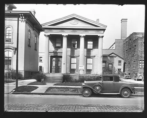 [Greek Revival House on Street with "Chicken Dinner" and "Garage for Rent" Signs, Syracuse, New York]