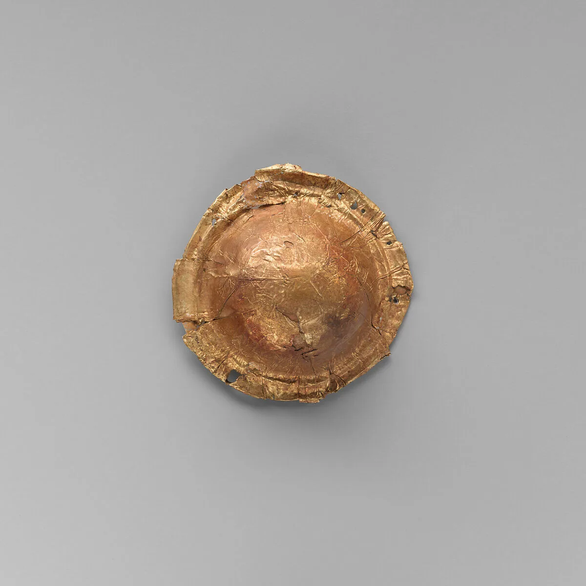 Gold roundel of bulbous form — Unknown