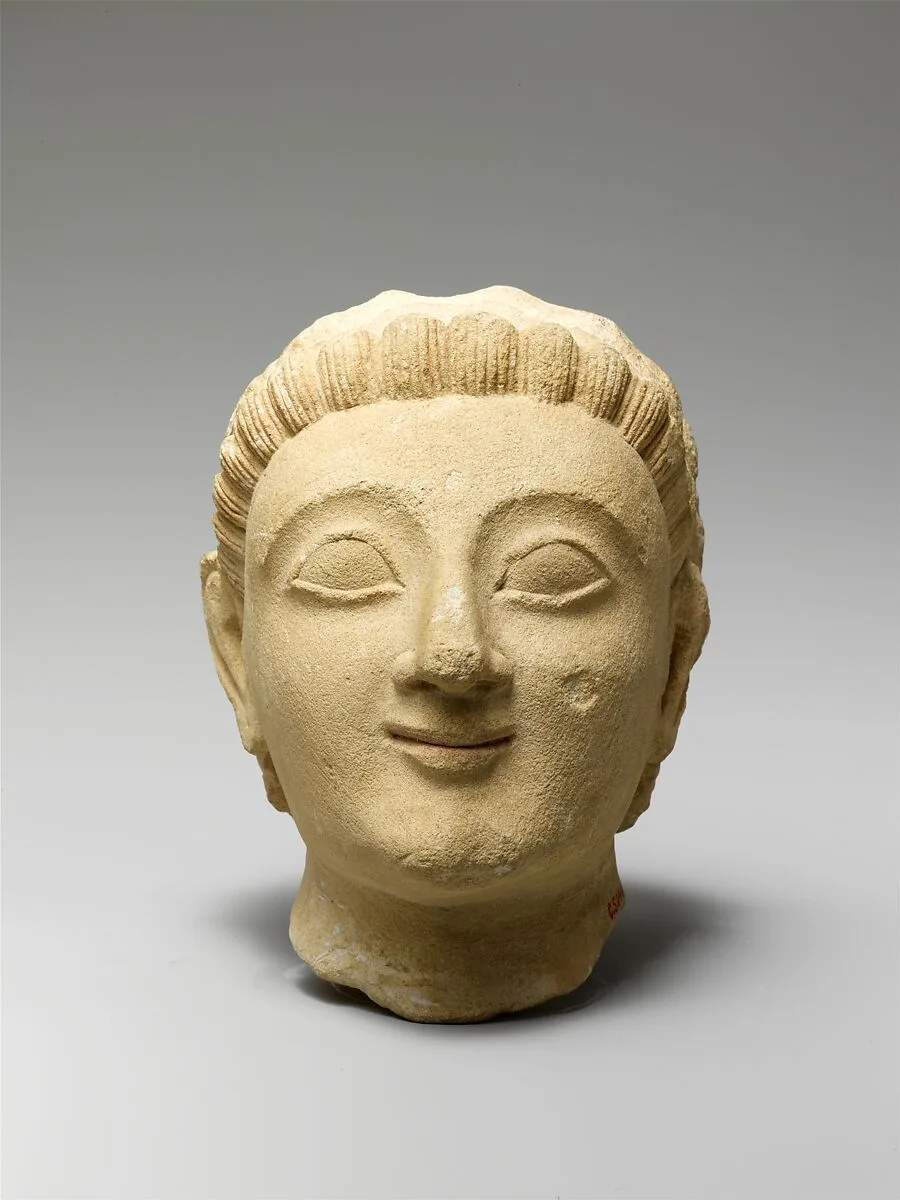 Limestone head of a beardless man — Unknown