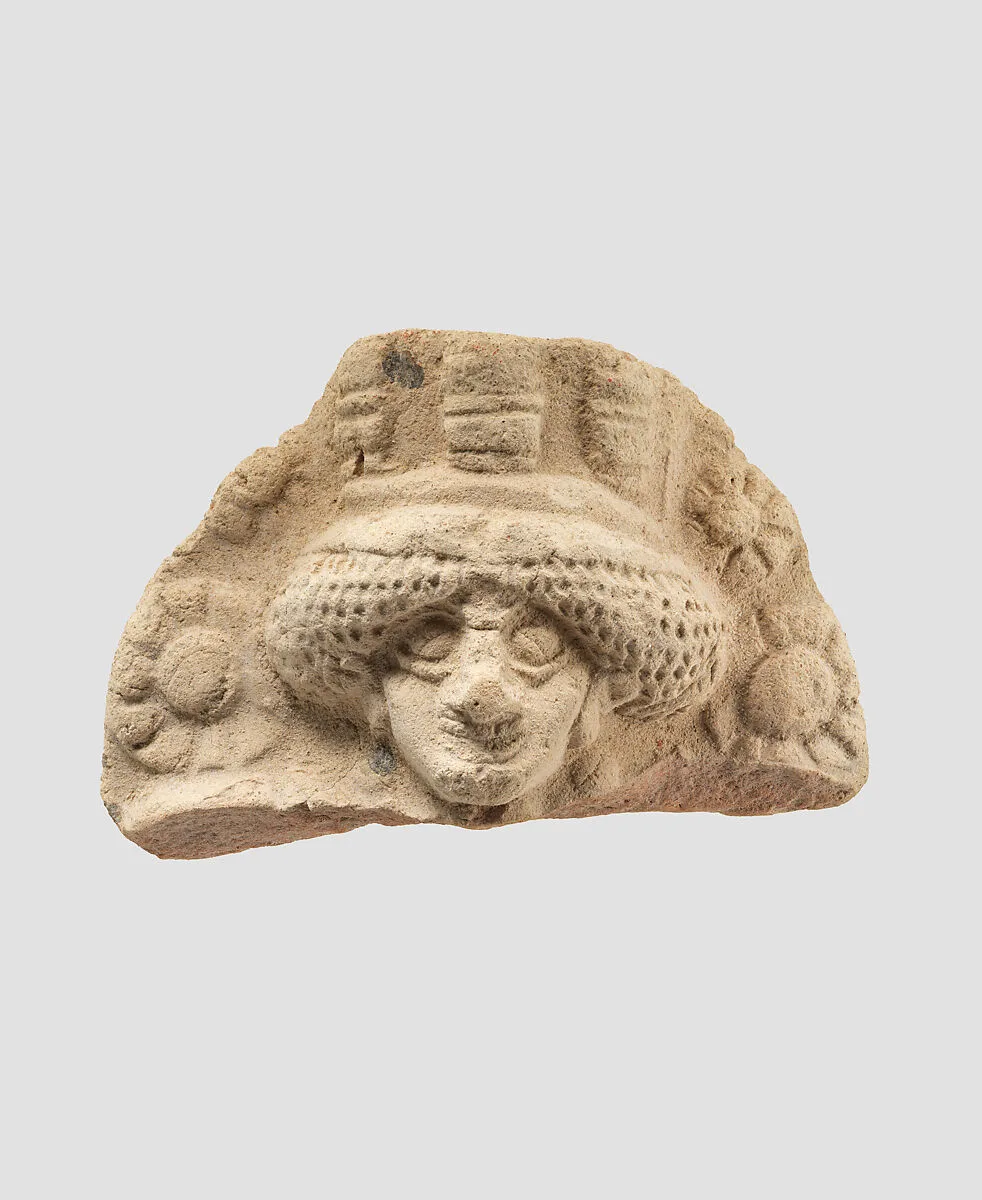 Molded plaque: female head — Unknown
