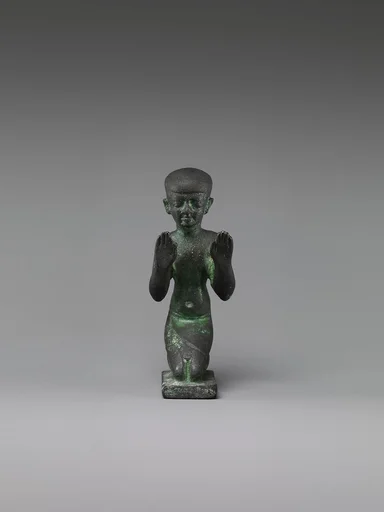 Statuette of an adorant from a group with a god