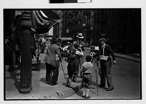 [Two 35mm Film Frames: Tintype Photographer and Group on Street Corner, New York City]