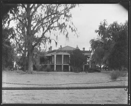 [Greek Revival (Plantation?) House with Wire Fence in Foreground]