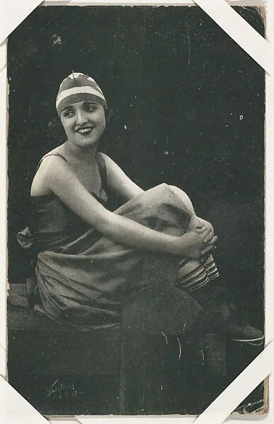 Actress in costume seated with arms around knees (W423) — Unknown