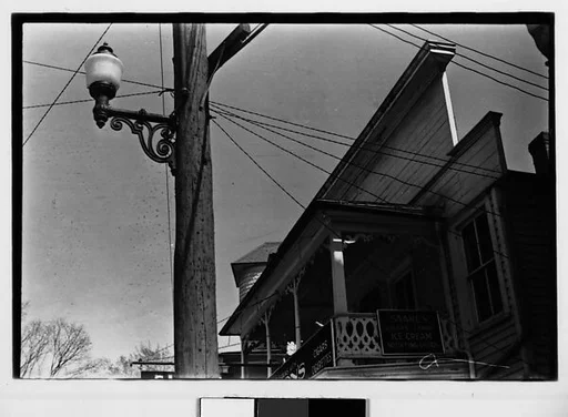 [Three 35mm Film Frames: Jigsaw Trim Roofline of Saake's Drugstore with Streetlight and Power Lines, Probably Millerton, New York]