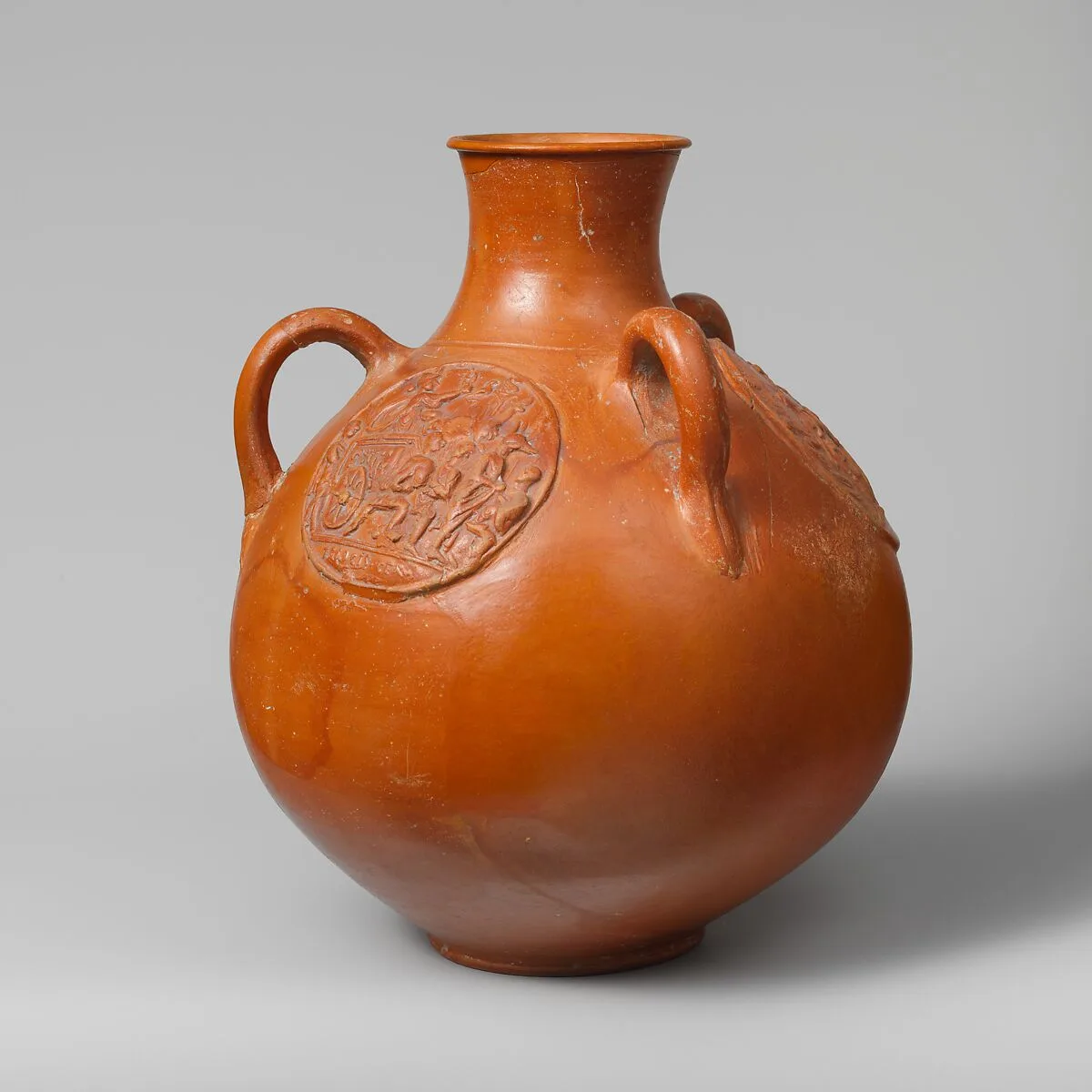 Three-handled jug with relief medallions — Unknown