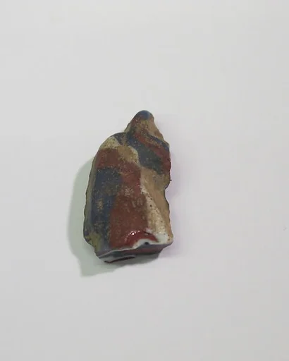 Mold-pressed amulet or fragment