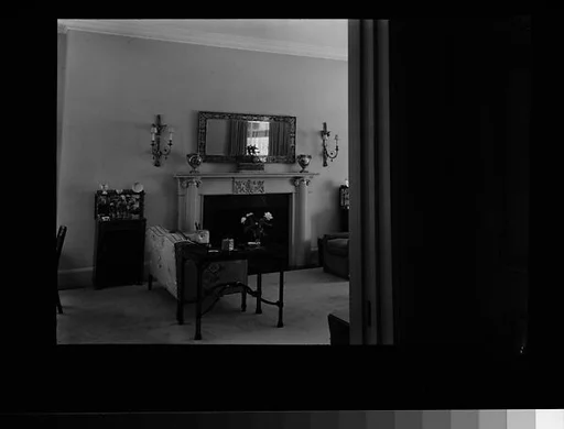 [Living Room Interior Showing Fireplace, Sofa, and Table]