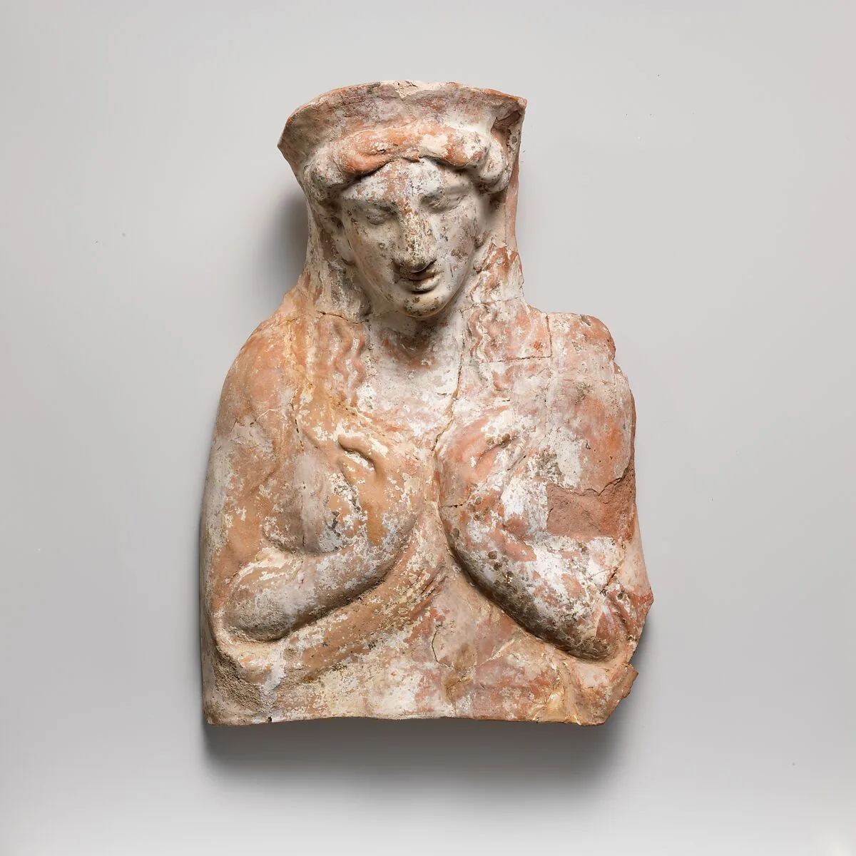 Terracotta relief with bust of a woman — Unknown