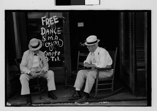 [Three 35mm Film Frames: Two Elderly Men in Conversation on Porch in Front of Painted Sign for "Free Dance", Greensboro, Alabama?]