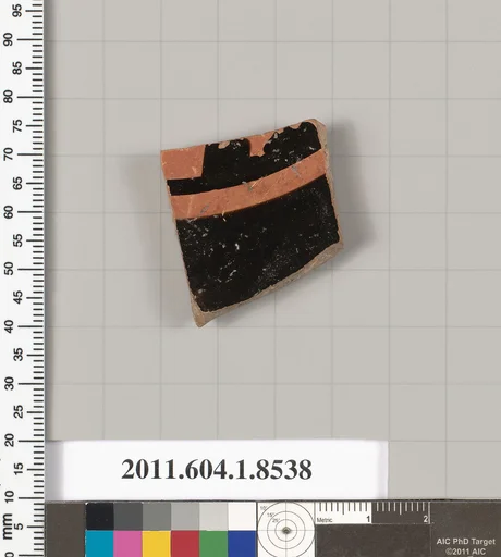 Terracotta fragment of a stemless kylix (drinking cup)