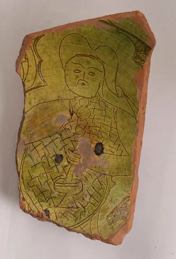Fragment with a Figure Holding a Flask